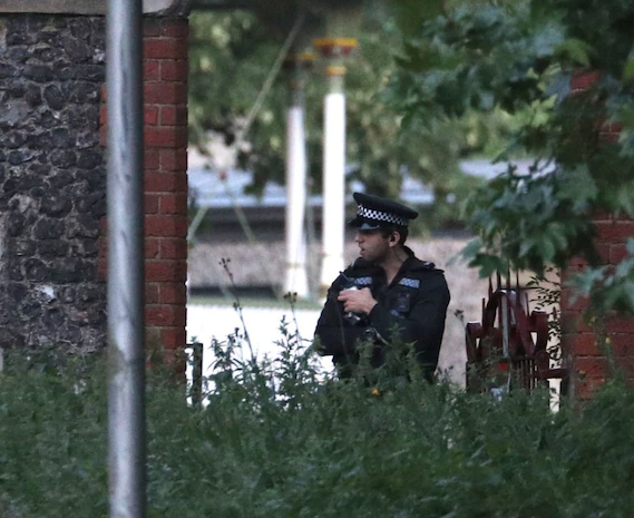 Police guard enterance to forbury gardens reading after terrorist mass stabbing