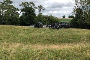 Gov supplied image of unrelated 4x4s near a river in shropshire